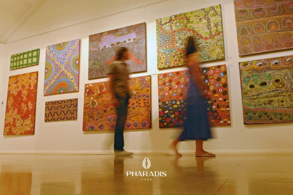 Guests viewing colorful local artwork in the gallery space at Pharadis brand new Hotel Maluk.